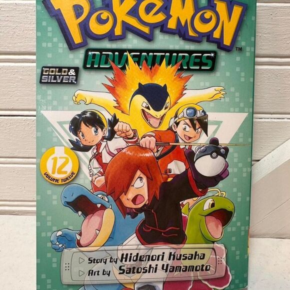 "Pokemon Adventures" and "Pokemon Super Extra Deluxe Essential Handbook" books - Picture 5 of 8